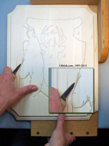 The two strokes of a stop cut in relief wood carving
