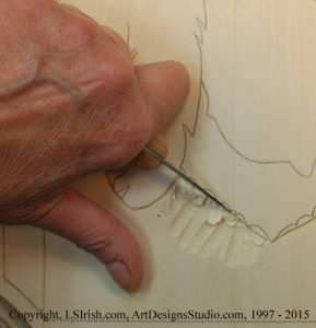 Bench knife cuts in relief wood carving