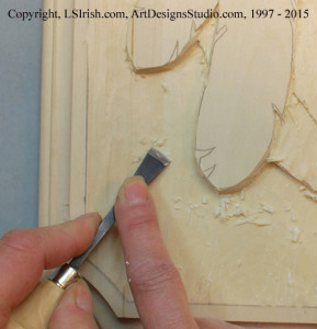 Smoothing the background of a relief wood carving