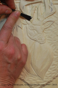 Shaping the Mule Deer body in wood carving