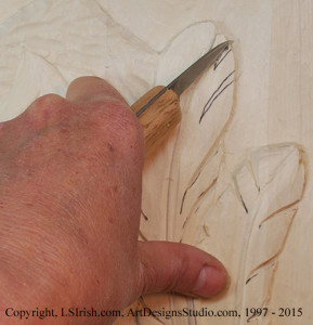 Shaping feathers in wood carving