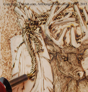 Adding animal fur with a wood burner to a relief wood carving