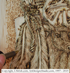 Adding animal fur with a wood burner to a relief wood carving