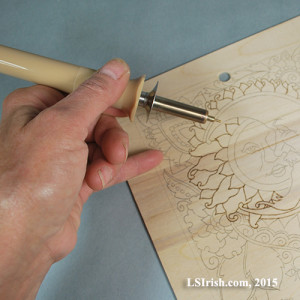 Hand position in wood burning