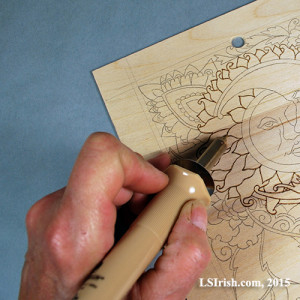 Hand position in wood burning
