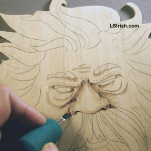 Shading the wood spirit face in pyrography