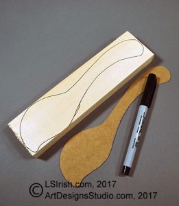 bench knife cutting a wood spoon blank