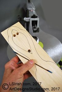 scroll saw cutting a wood spoon blank